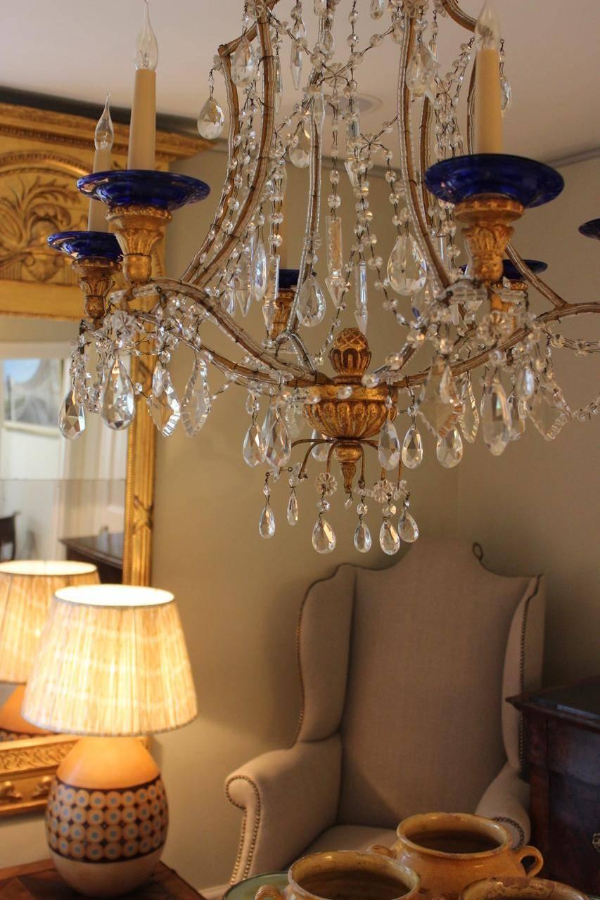 A glamorous clear and blue glass, giltwood and beaded gilt-metal six-arm chandelier, Italian, 1930s.