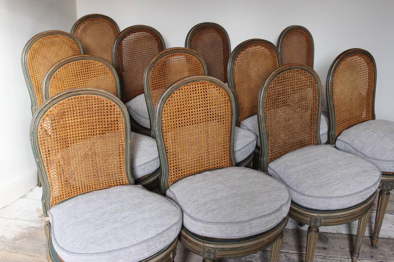 French Set of 12 Louis XVI Style Painted Dining Chairs, circa 1920s