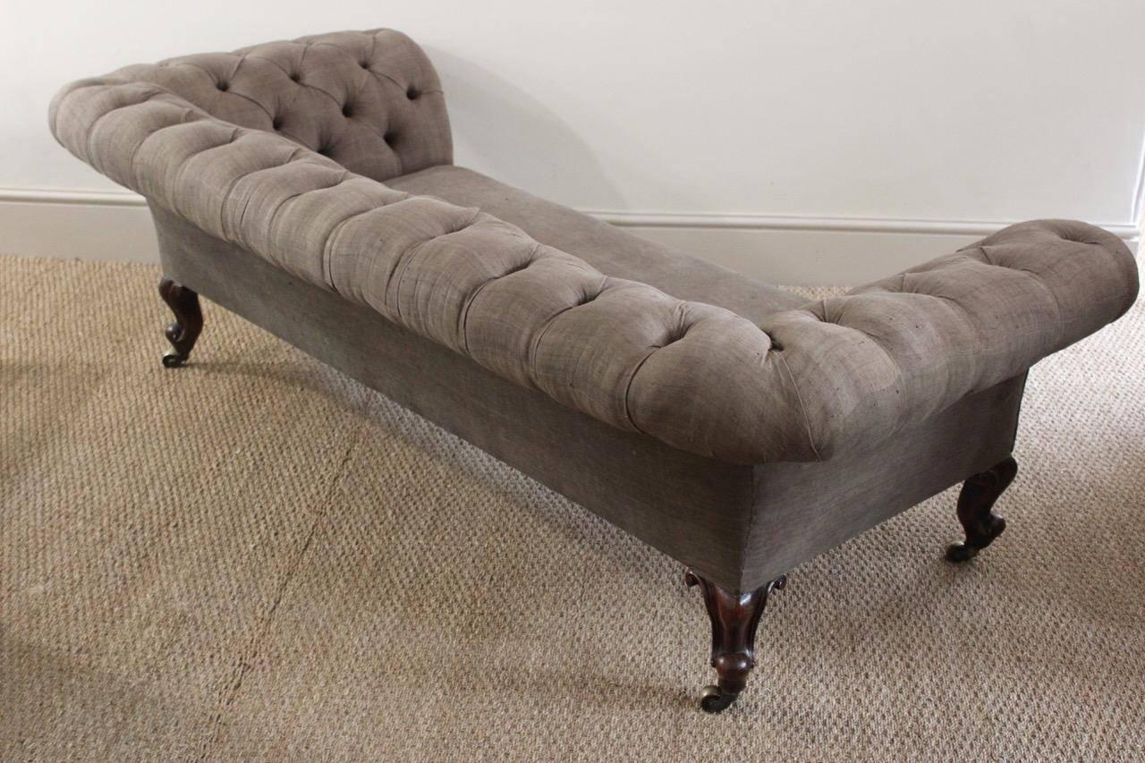 A very elegant 19th century 'Country House' deep button-back sofa, of good proportions and very comfortable, with cabriole mahogany legs retaining the original brass castors. Very recently reupholstered by us in a 19th century hand dyed linen,