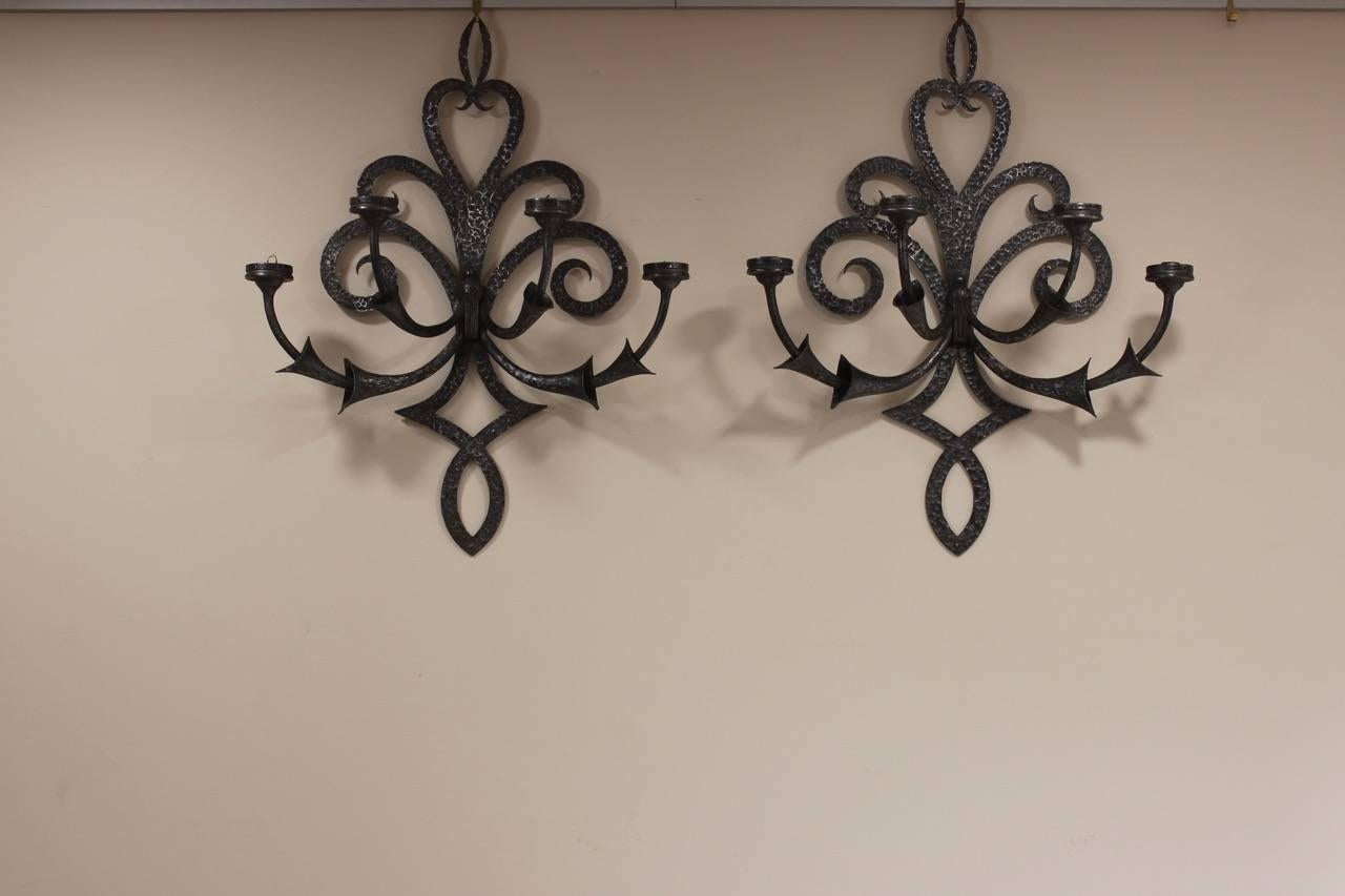 A large and very stylish pair of Spanish wall lights in hammered steel, circa 1950s.
 