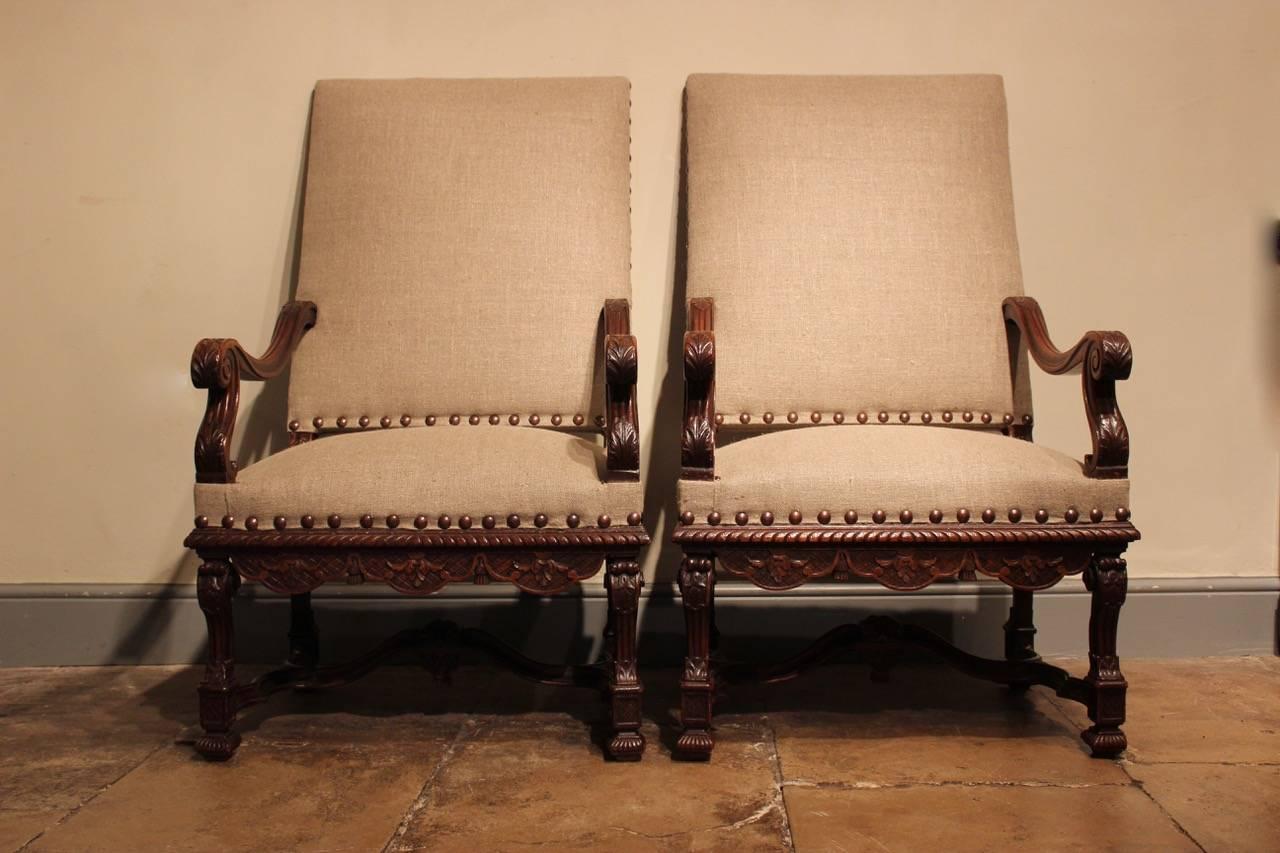 A good and large pair of 19th century French carved walnut armchairs reupholstered by us in a neutral linen with studded detail. This elegant pair of fauteuils will work well in most settings. 

Measures: Seat height 50 cm.