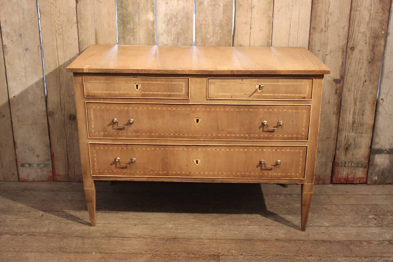 A good quality and of simple, yet elegant lines, late 18th century Italian commode in bleached walnut with inlaid detail and three drawers, that will work well in most settings.
