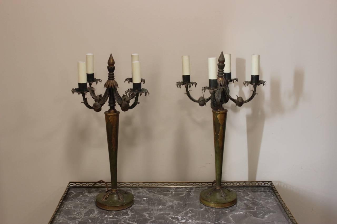 A highly decorative pair of Italian green-painted and gilt-highlighted four-branch table lamps, circa 1930s	