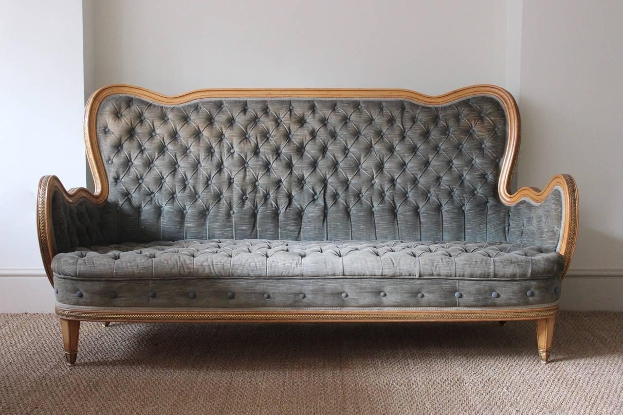 A very stylish, and of great quality, circa 1940s Spanish sofa of elegant form, in sycamore with carved and gilded channels and ebonized line decoration.