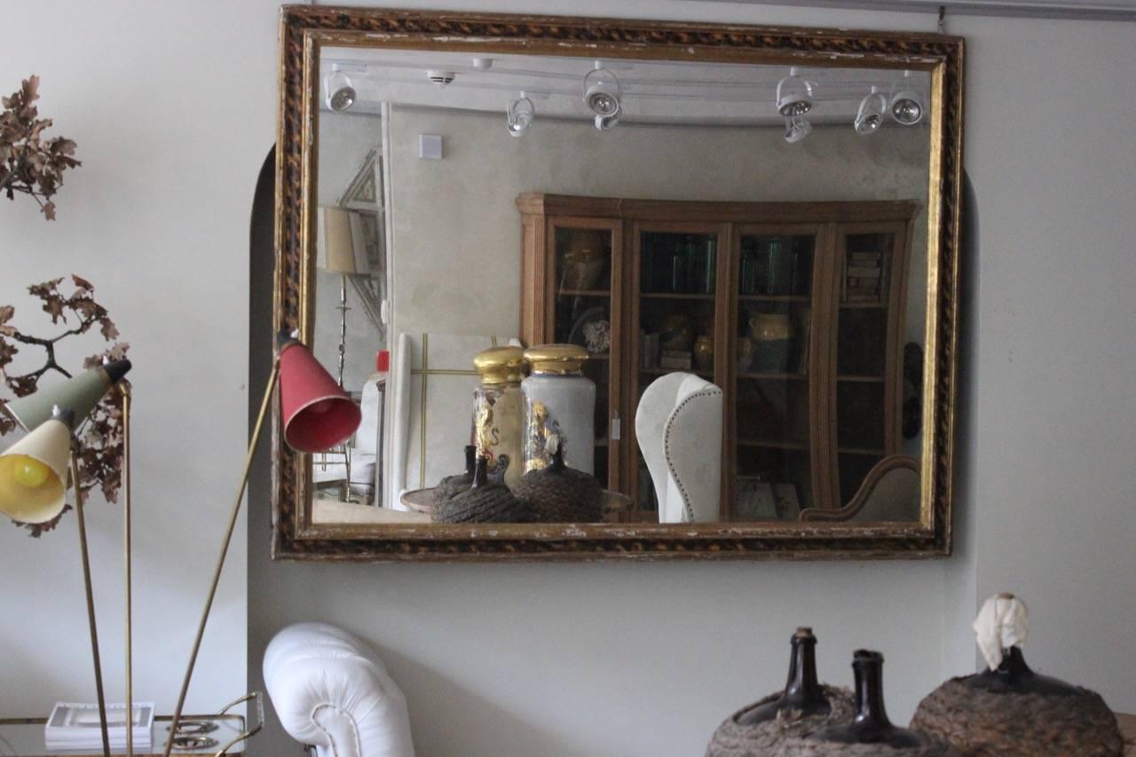 A very large and wonderfully decorative faux tortoiseshell and gilded rectangular wooden frame, with a later distressed mirror plate, that would make a statement in most settings and can be hung either landscape or portrait. 

Originally the frame
