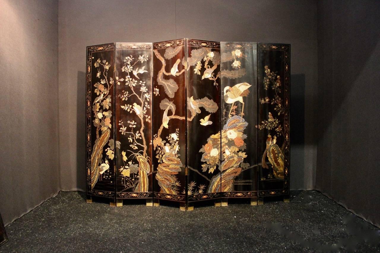 A very elegant and of great quality, late 19th century Meiji period, Japanese lacquer screen decorated on both sizes, that will make a statement in most settings.