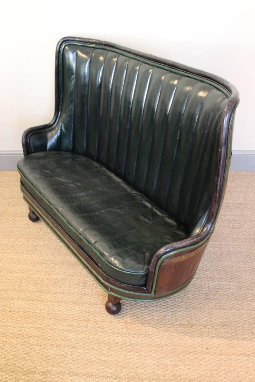 Circa 1930s Spanish Oak Barrel Sofa in Leather In Good Condition In Gloucestershire, GB