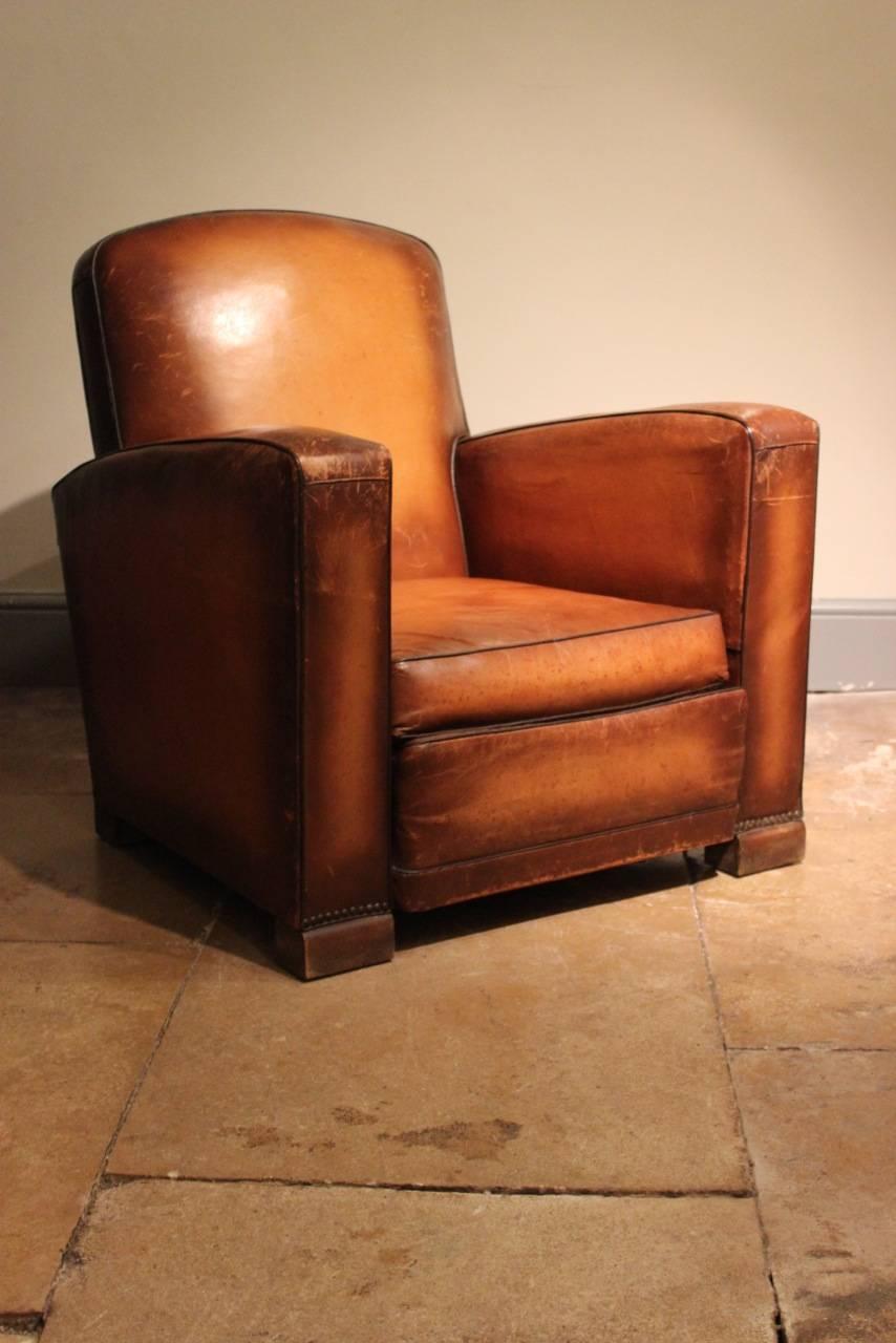 A good quality, 1930s French leather armchair of cube form , with a lovely colour, retaining the original leather. 