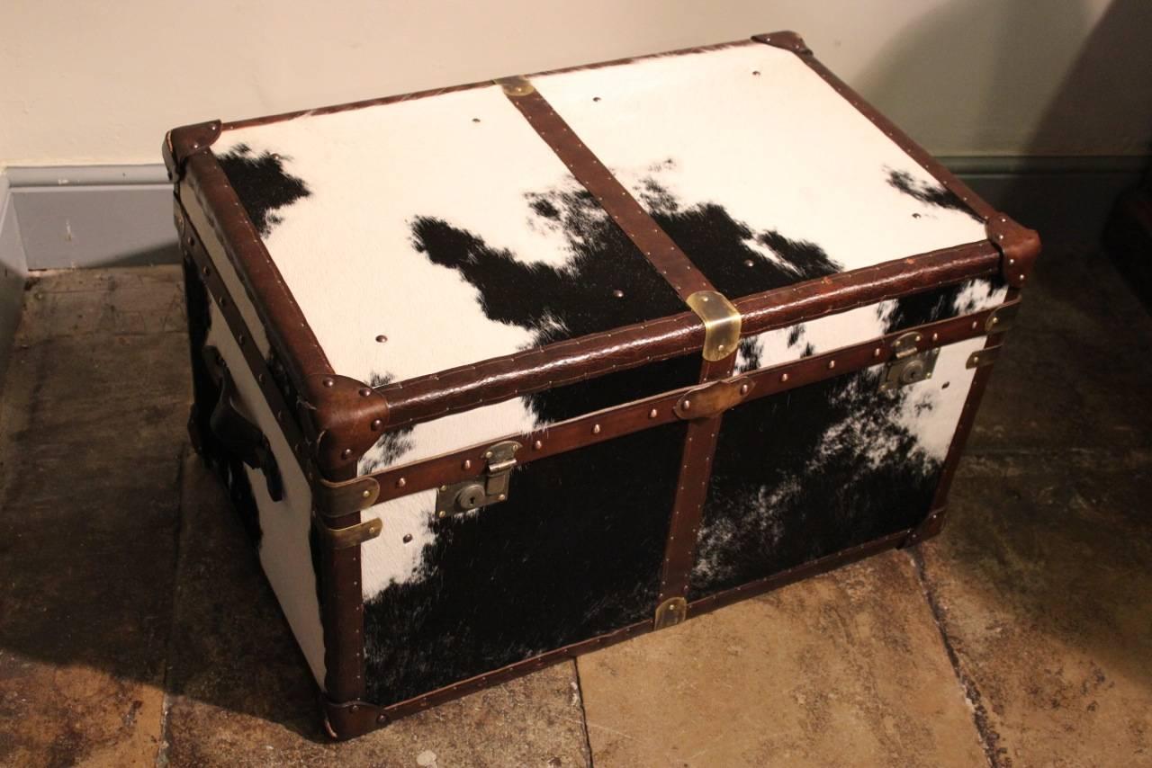 A good quality and made exclusively for Brownrigg, coffee table / trunk, in cowhide trimmed in 1920s leather, that will work well in most settings.