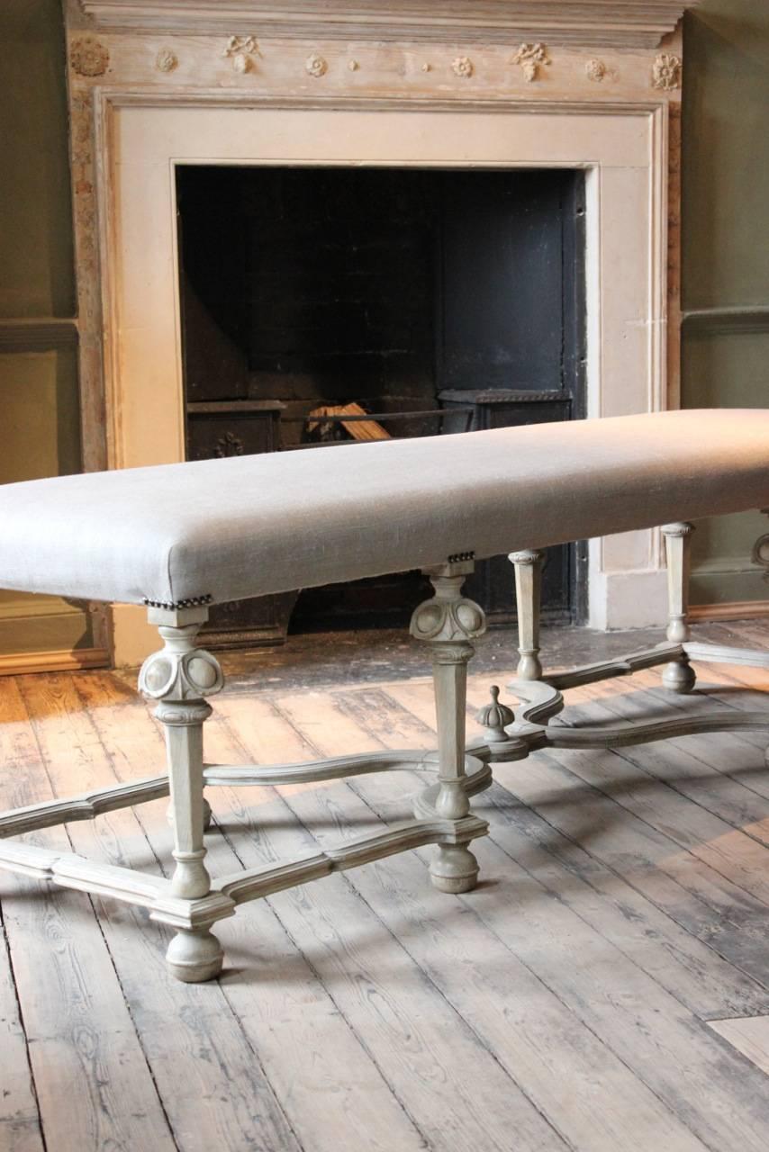 A great quality and with a lovely shape, late 19th century French eight legged stool, in bleached oak, recently reupholstered in neutral linen, that will work well either as a window seat or as a coffee table, circa 1880-1900.