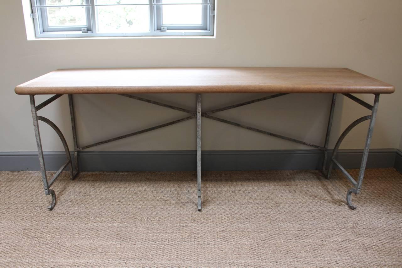 A good quality circa 1920s French console table, in wrought iron, with a wonderful oak top.