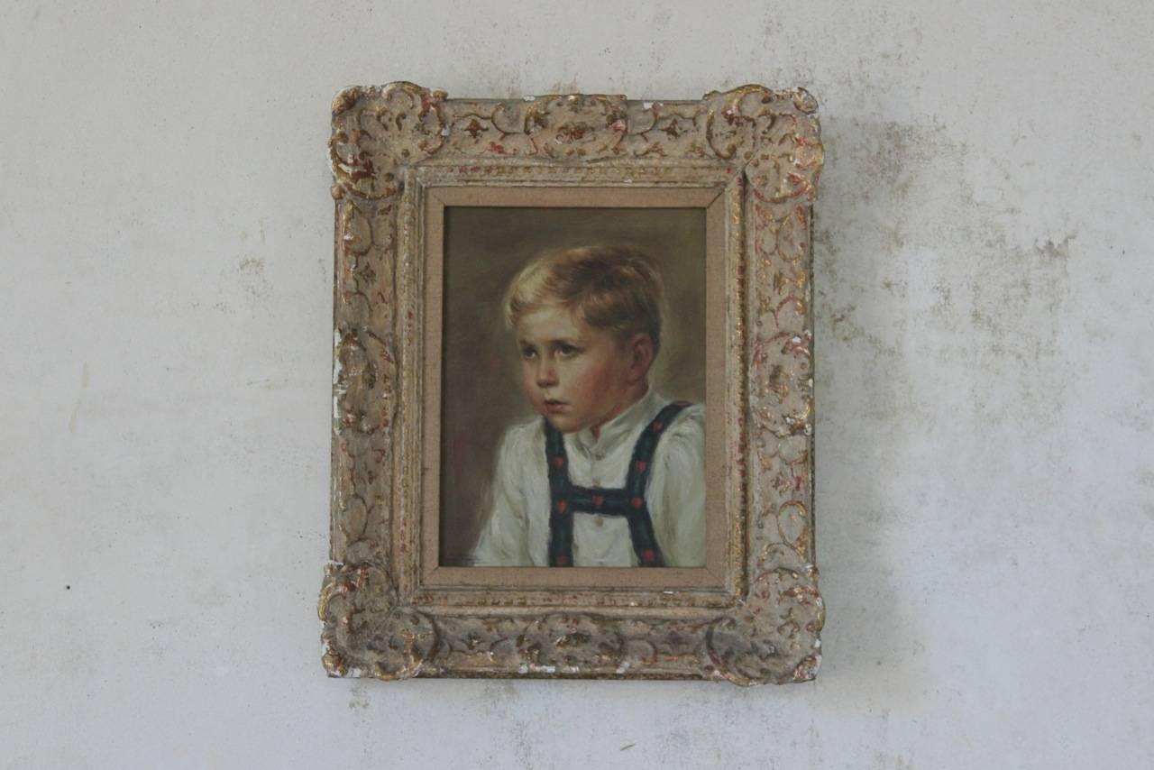 A very charming and well executed early to mid-20th century oil on canvas portrait of a child.