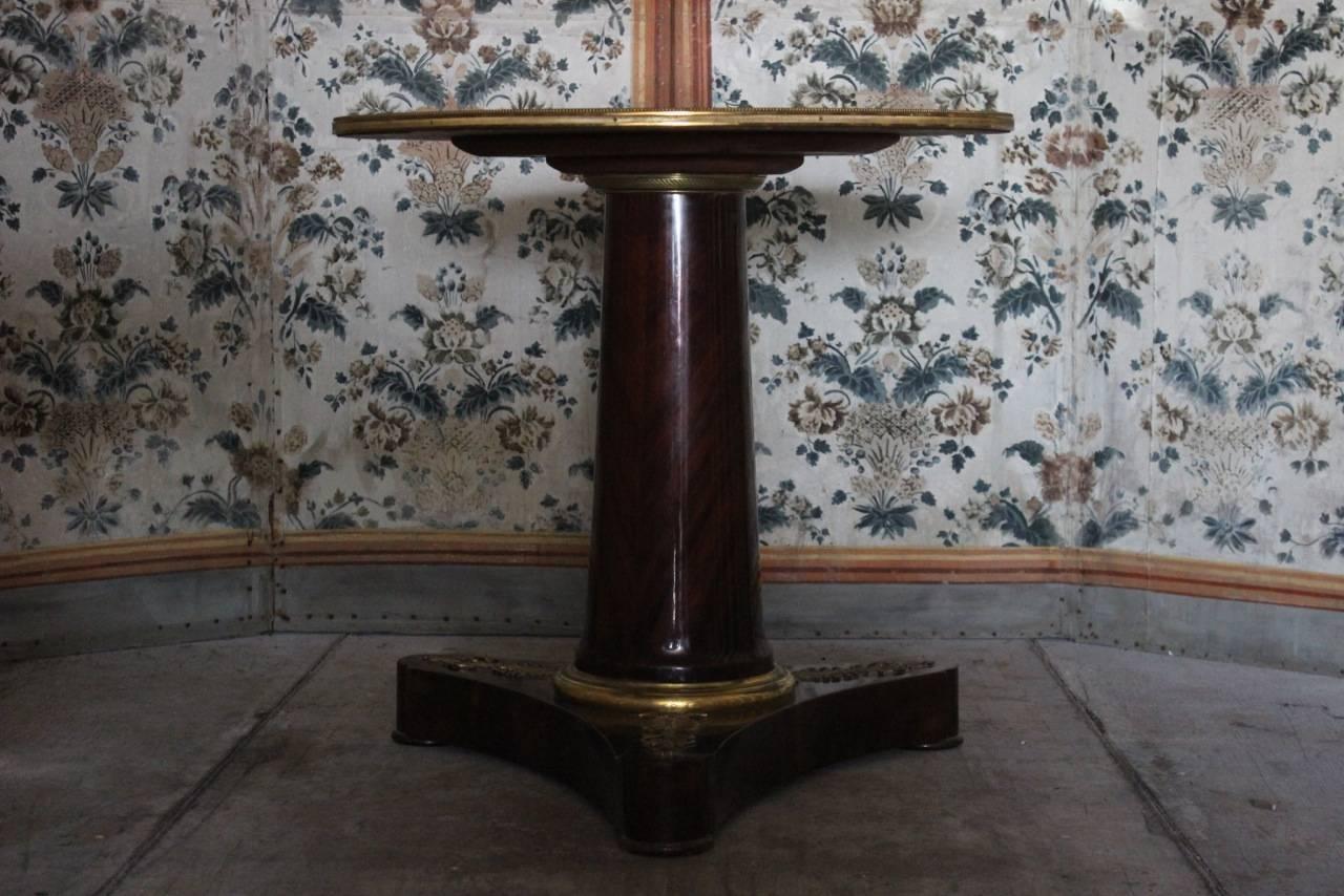 A good quality, early 19th century Baltic gueridon in mahogany with brass mounts and replacement top, of elegant proportions.
 