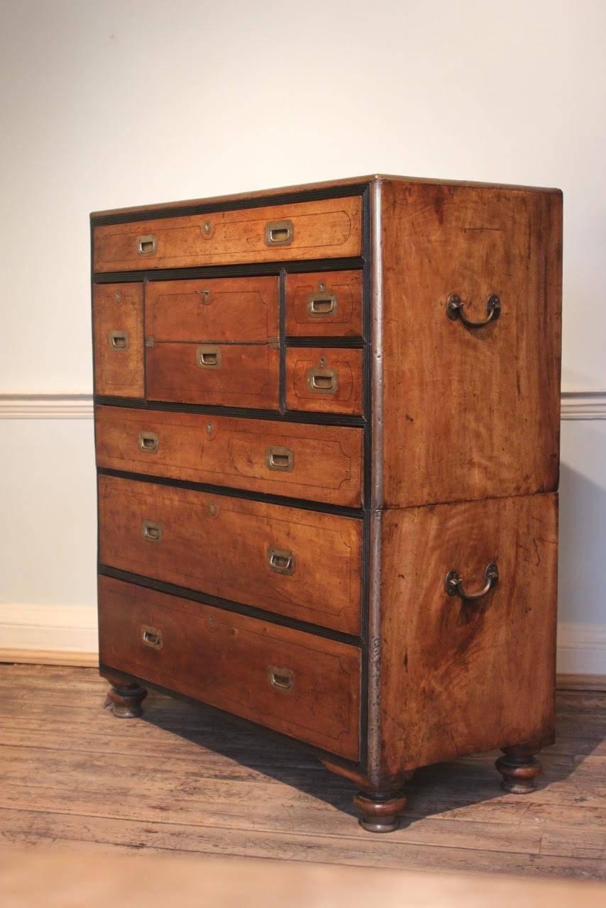 A wonderful quality mid-19th century Campaign chest, in camphor wood with ebonised detail, with a pull-out writing desk. Great color. 

This Campaign chest comes in two pieces for easy transportation, 

circa 1860.
