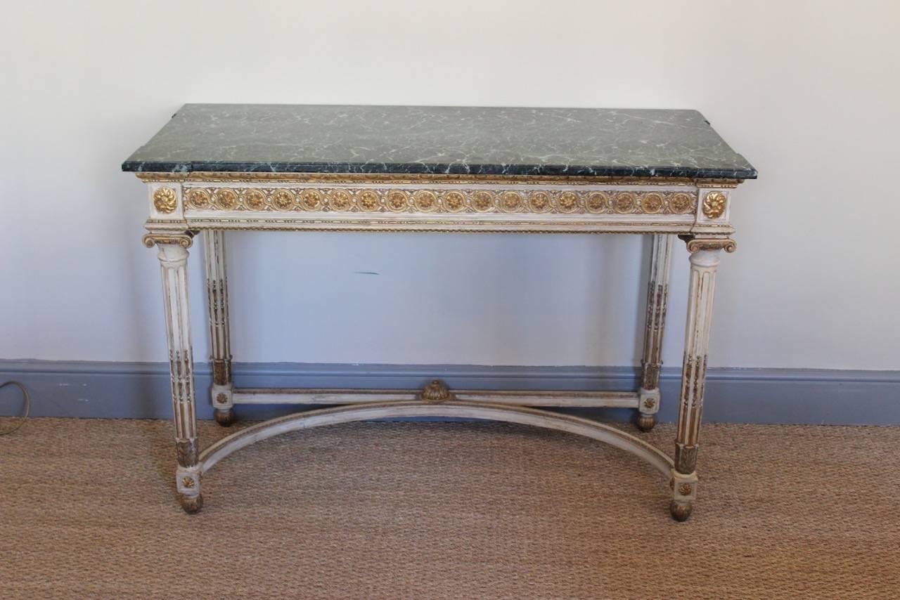 A good quality, late 19th century French console table in the neoclassical taste of elegant proportions, retaining its original paint and gilding and green marble top.
France, circa 1900.
 
