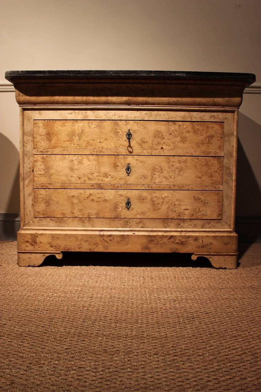 A very good quality and with a lovely colour, 19th century French Louis Philippe commode in bleached burr elm, with five drawers, retaining its original marble top,
France.
