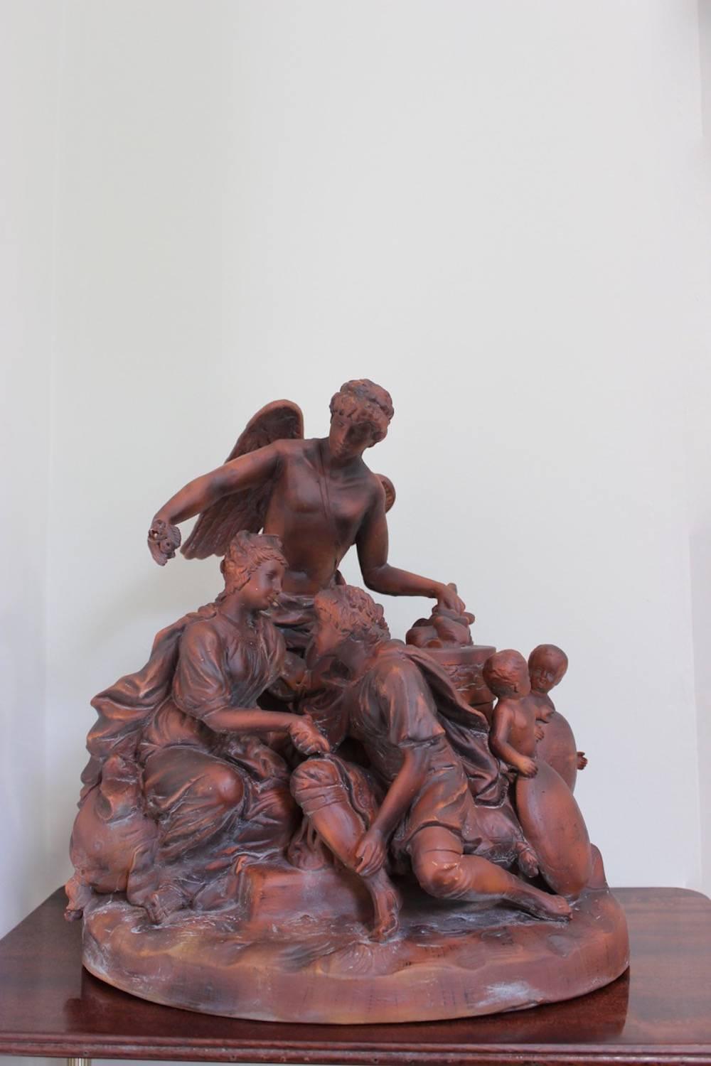 A well executed Austrian, late 19th or early 20th century patinated terracotta allegorical group by the Goldscheider manufactory.