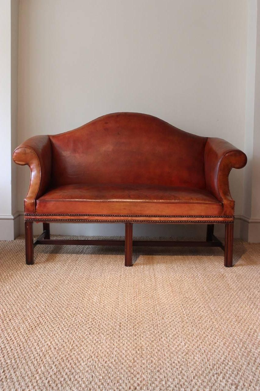 A great pair of Georgian-style mahogany and red morocco leather sofas with original upholstery, that would make a statement in most settings. English, early to mid-20th century.
 