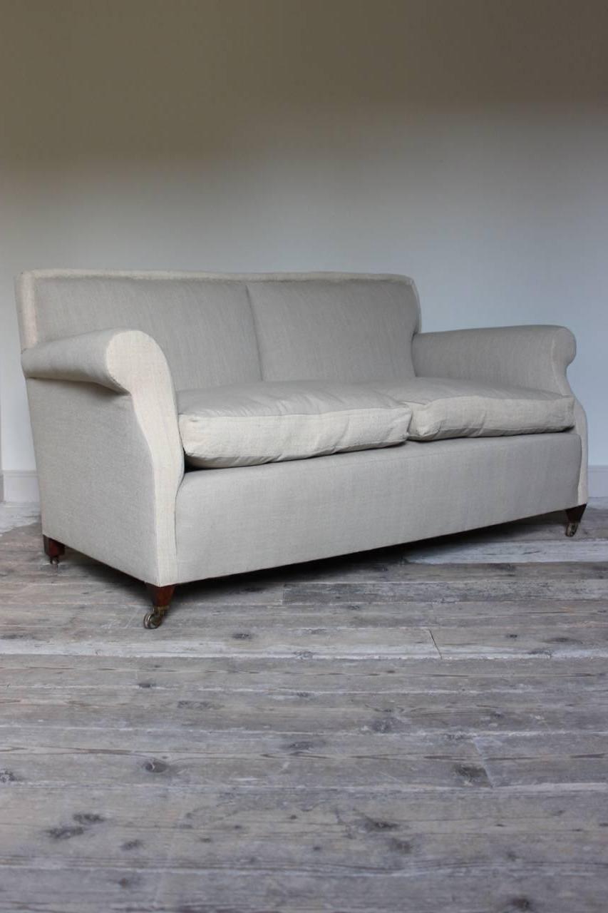 A very elegant and comfortable, circa 1920s, two-seat sofa, having been reupholstered in two contrasting neutral vintage linens and with feather seat cushions. 

Measure: Seat height 44cm.
