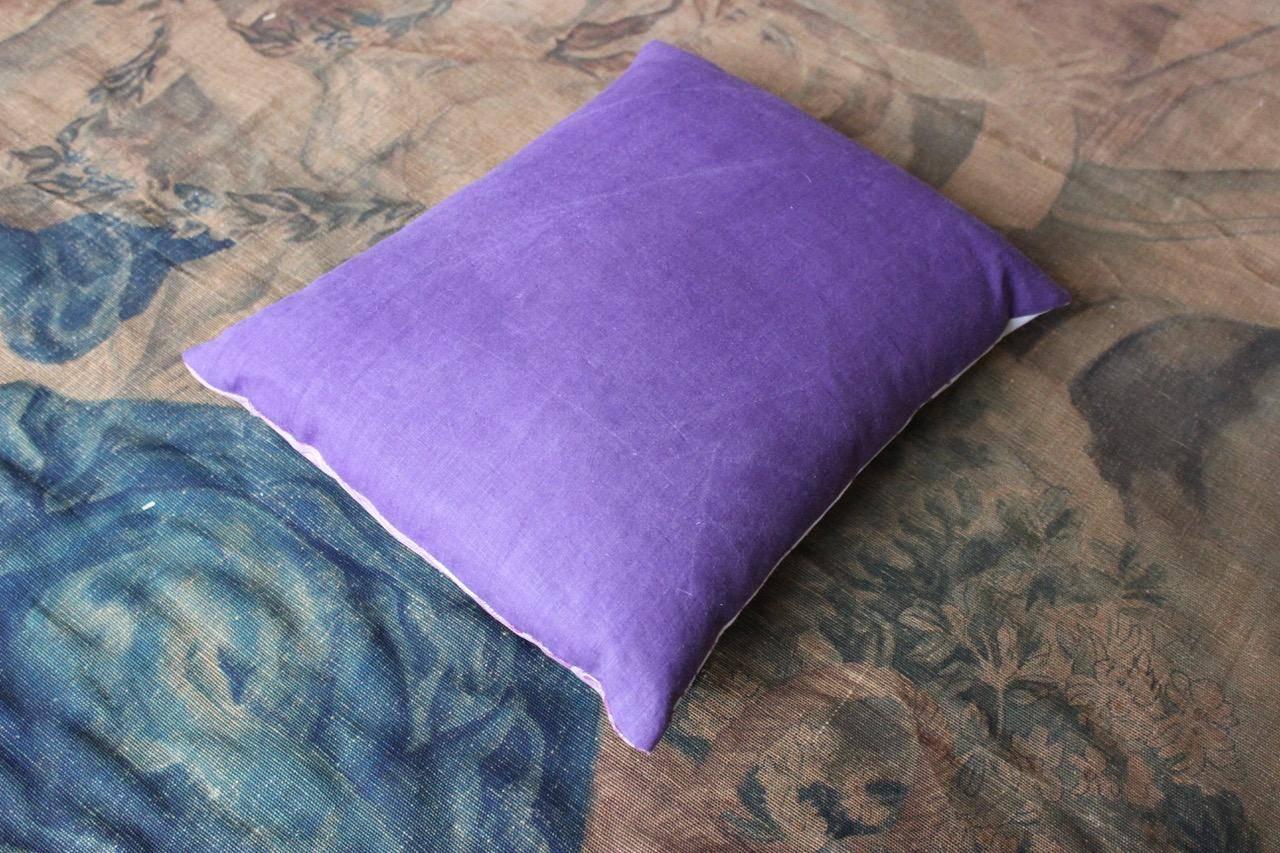A 19th century French Toile de Jouy “Four Continents” cushion, with 18th century purple linen backing.
  