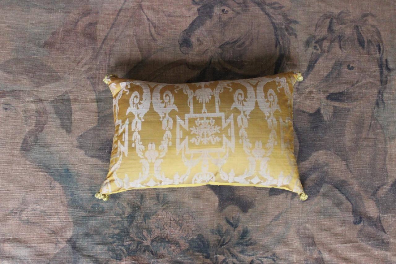 A fine and rare pair of 19th century French golden-yellow silk damask and fringe cushions, backed with 18th century burette (minor variations in size).