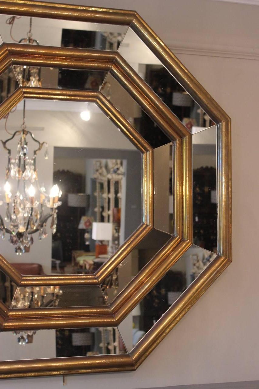 A good 1970s brass and mirror-glass framed octagonal mirror that would work well in a contemporary setting, signed R. Dubarry.
 