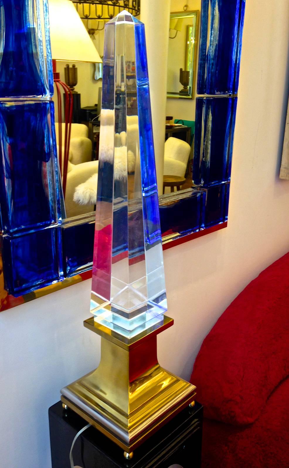 Spectacular pair of big obelisk french lucite lighted lamps on a gold bronze base.