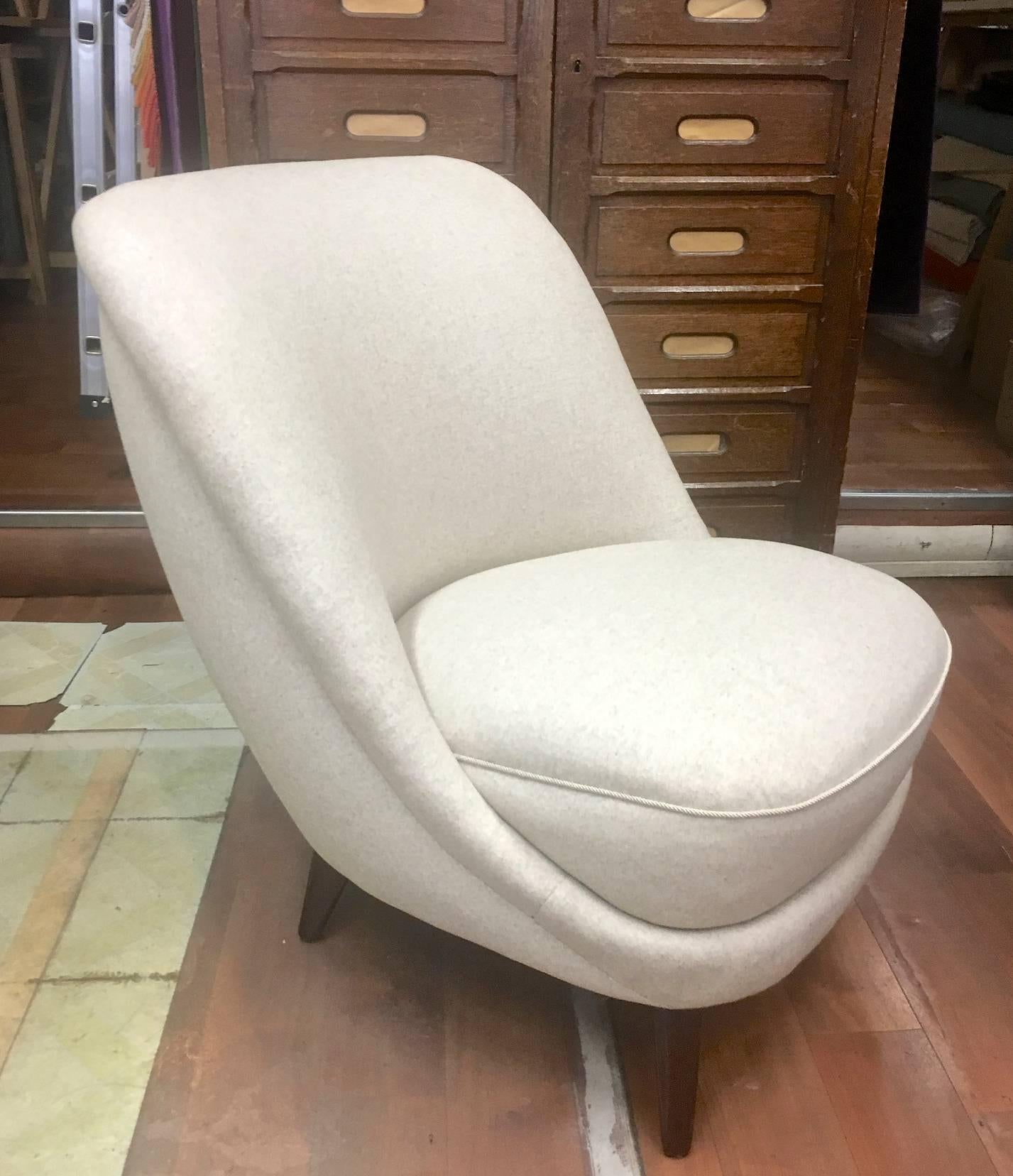 In the style of Gio Ponti pair of elegant slipper chair covered in neutral wool.