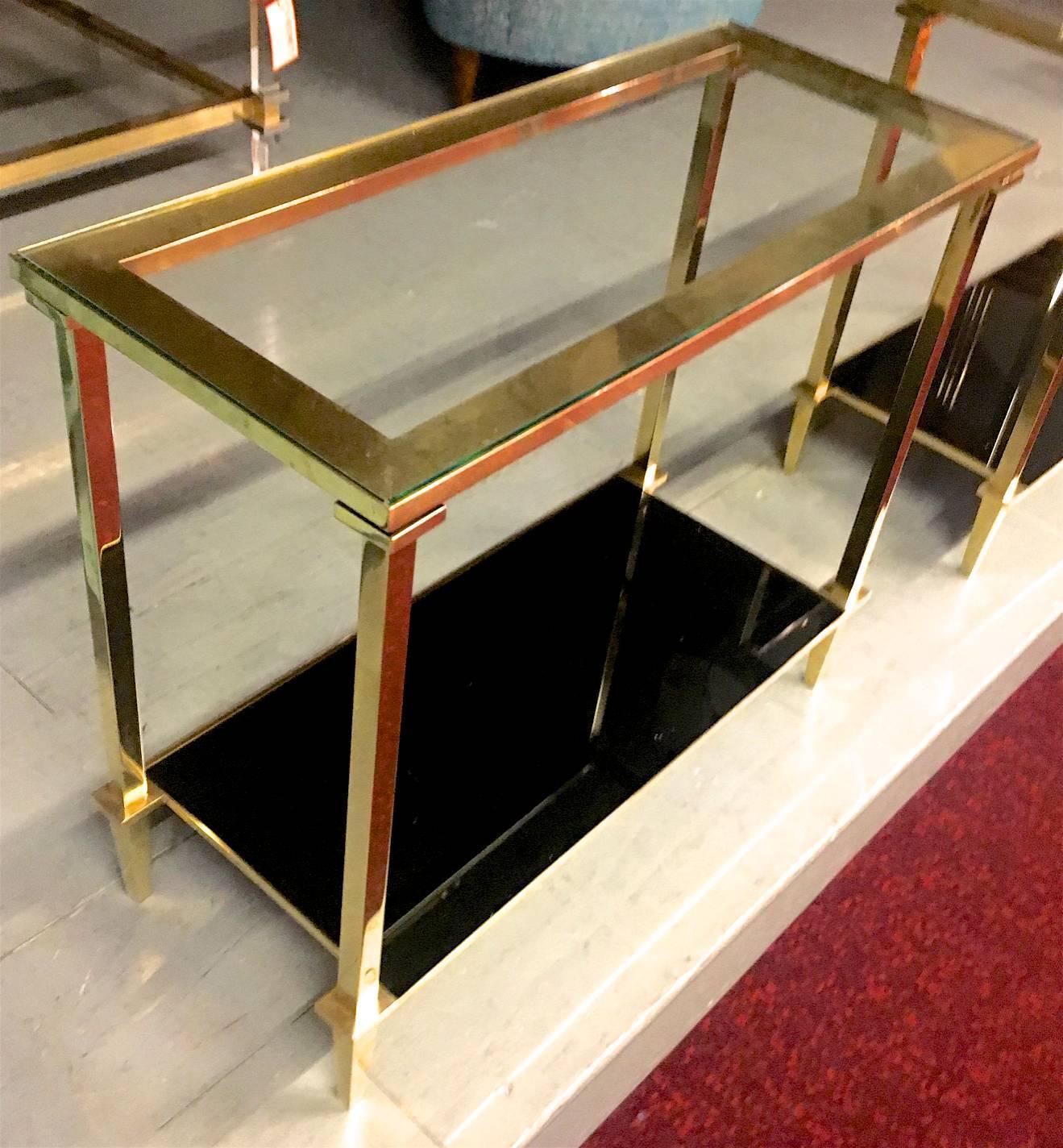 Refined pair of two tiers side tables with bronze pure hardware.