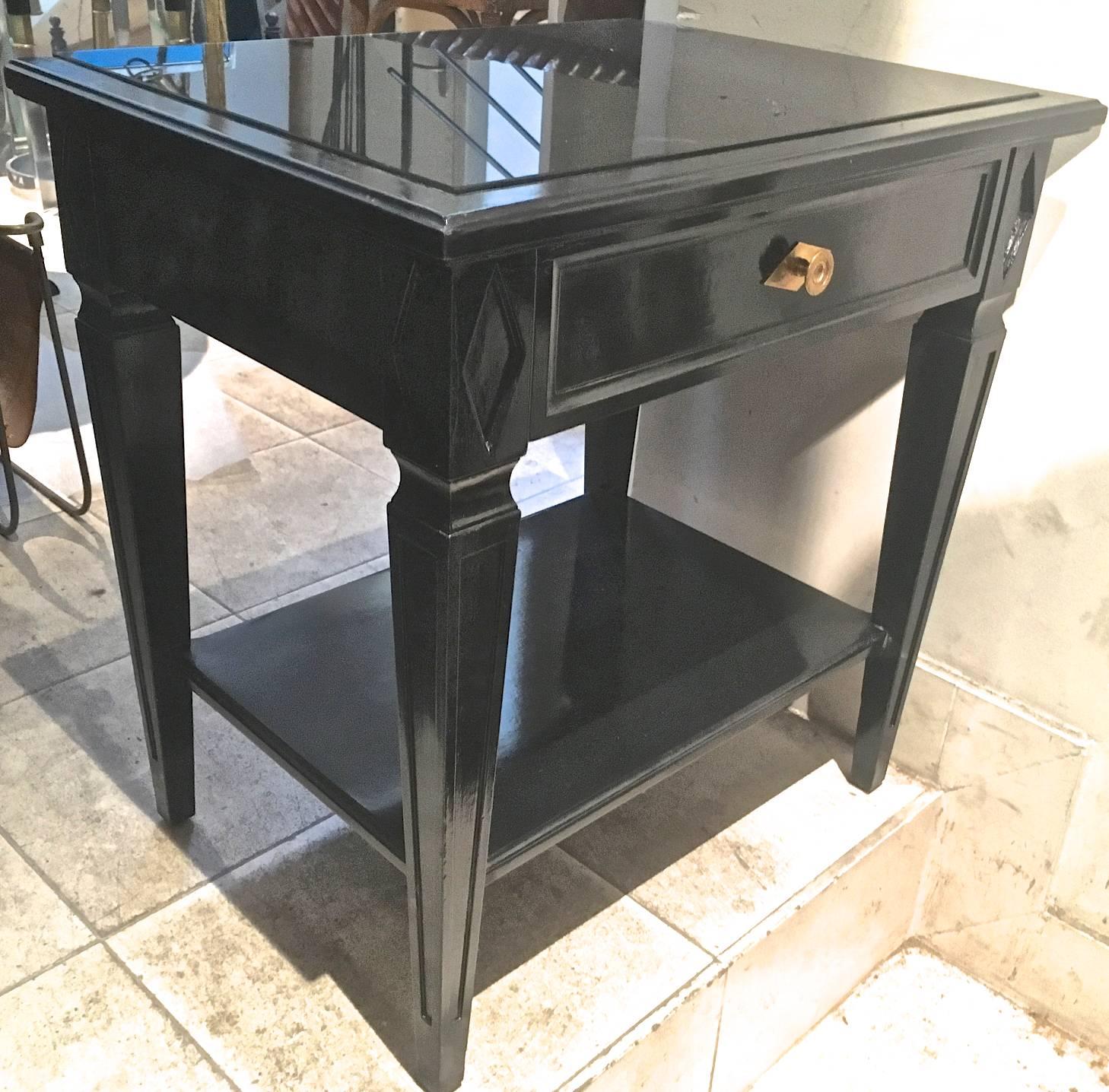 Maison Jansen pair of blackened wood bedside or side table with a black opaline top attributed to Maison Jansen.