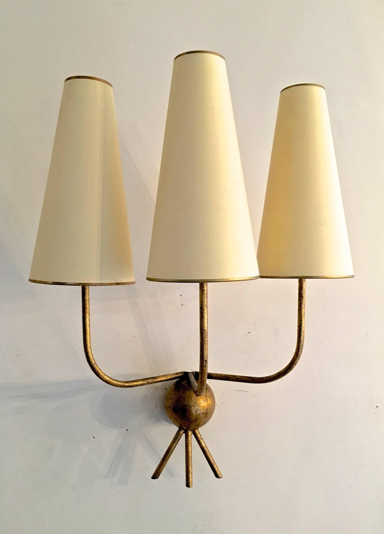 Jean Royère pair of gold leaf wrought iron pair of three-light sconce mode 