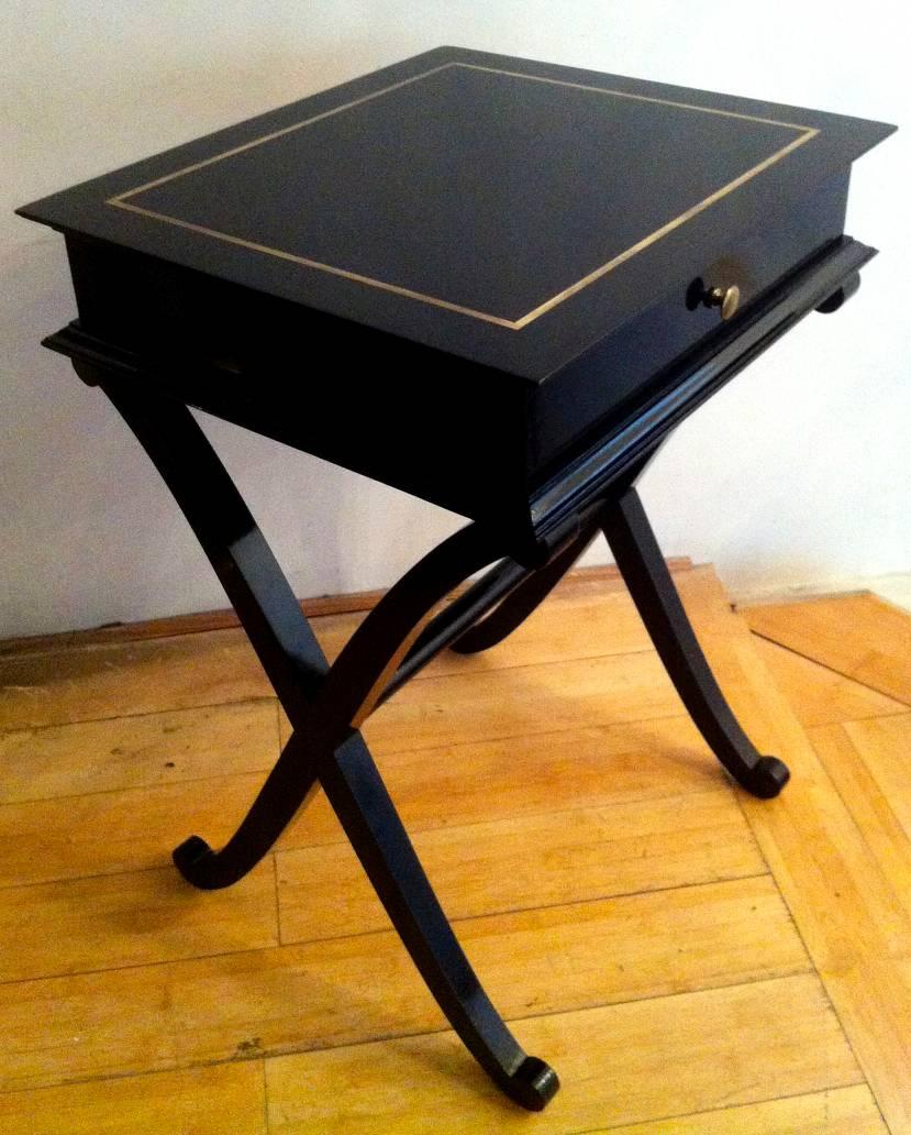 Maurice Hirsch stamped 'X' shaped black lacquered side tables or bedsides.
