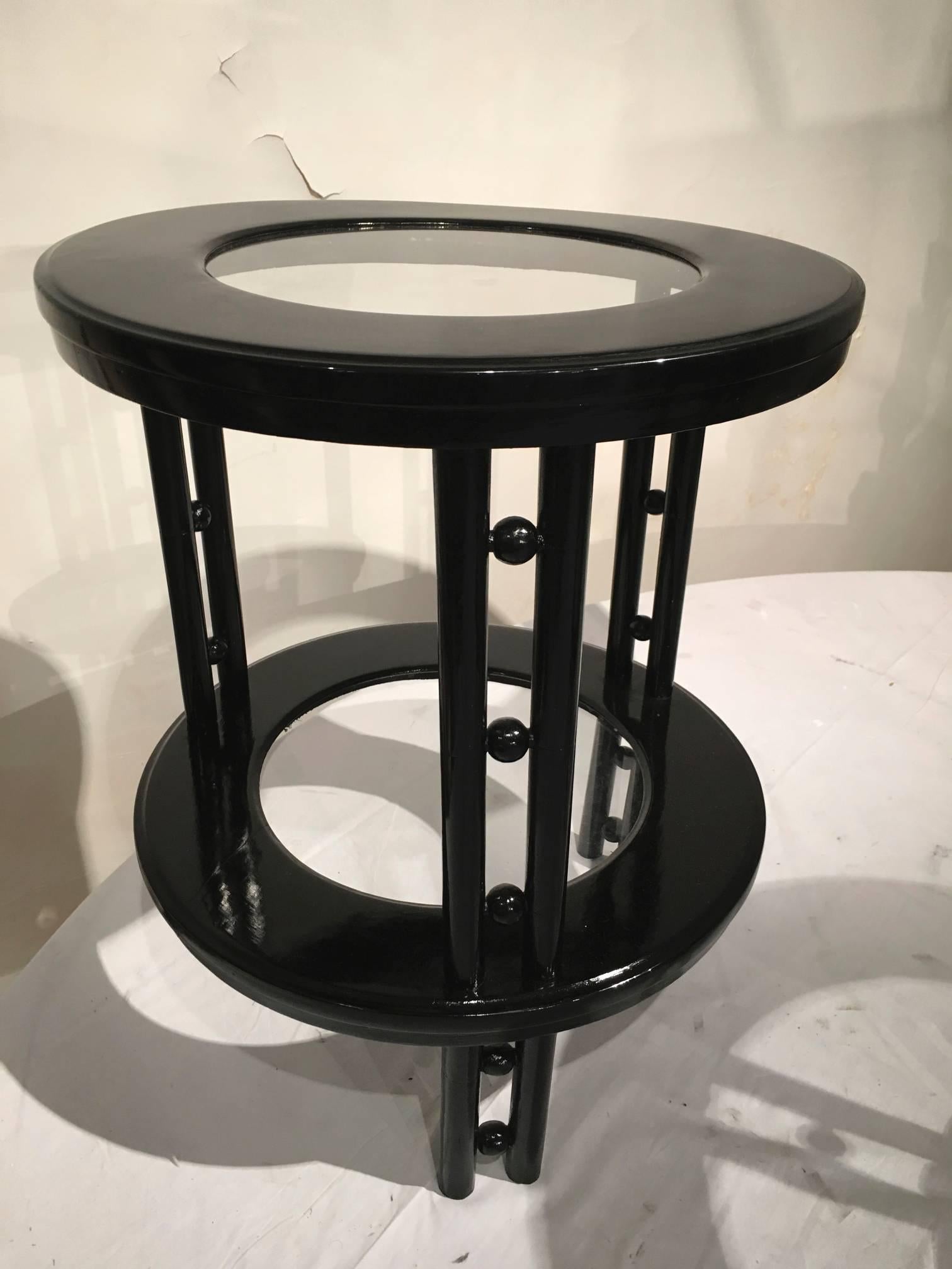 Josef Hoffmann pair of secession two-tier side tables in black lacquer.
