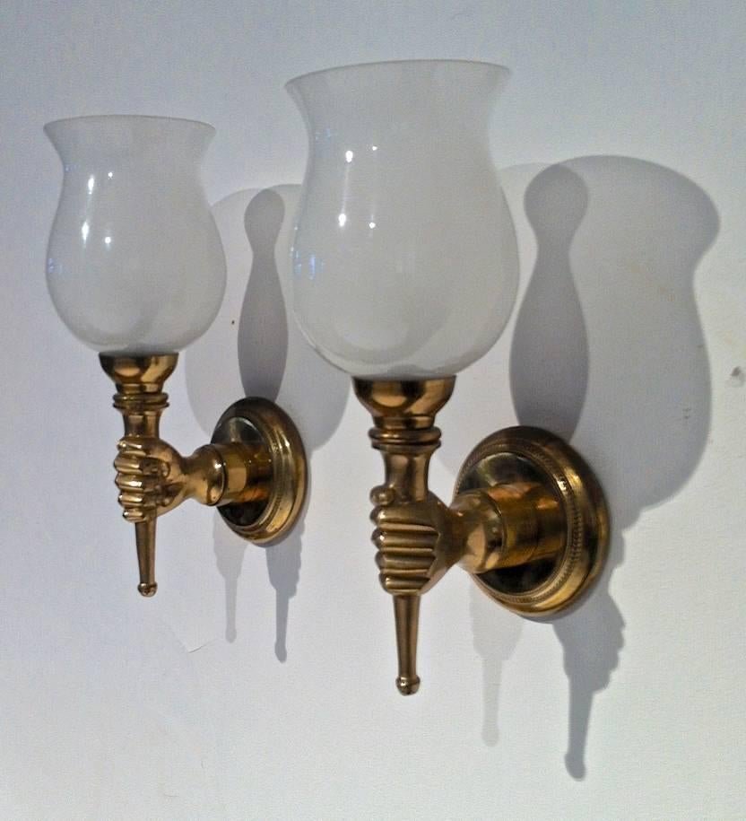 John Devoluy set of four gold bronze hand sconces with opaline cup.