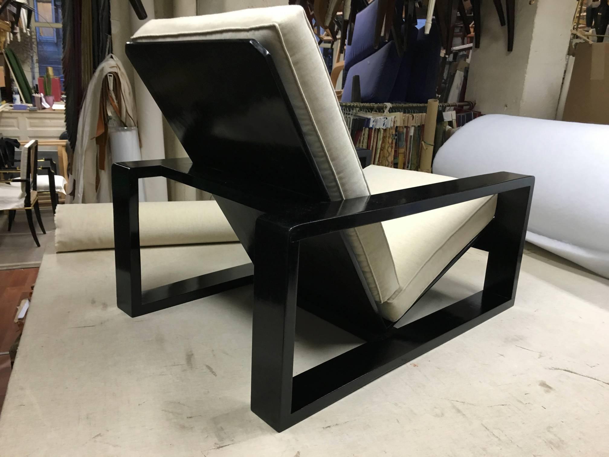Style of Jean Royère pair of awesome comfortable black lounge chairs fully restored in raw white cover.