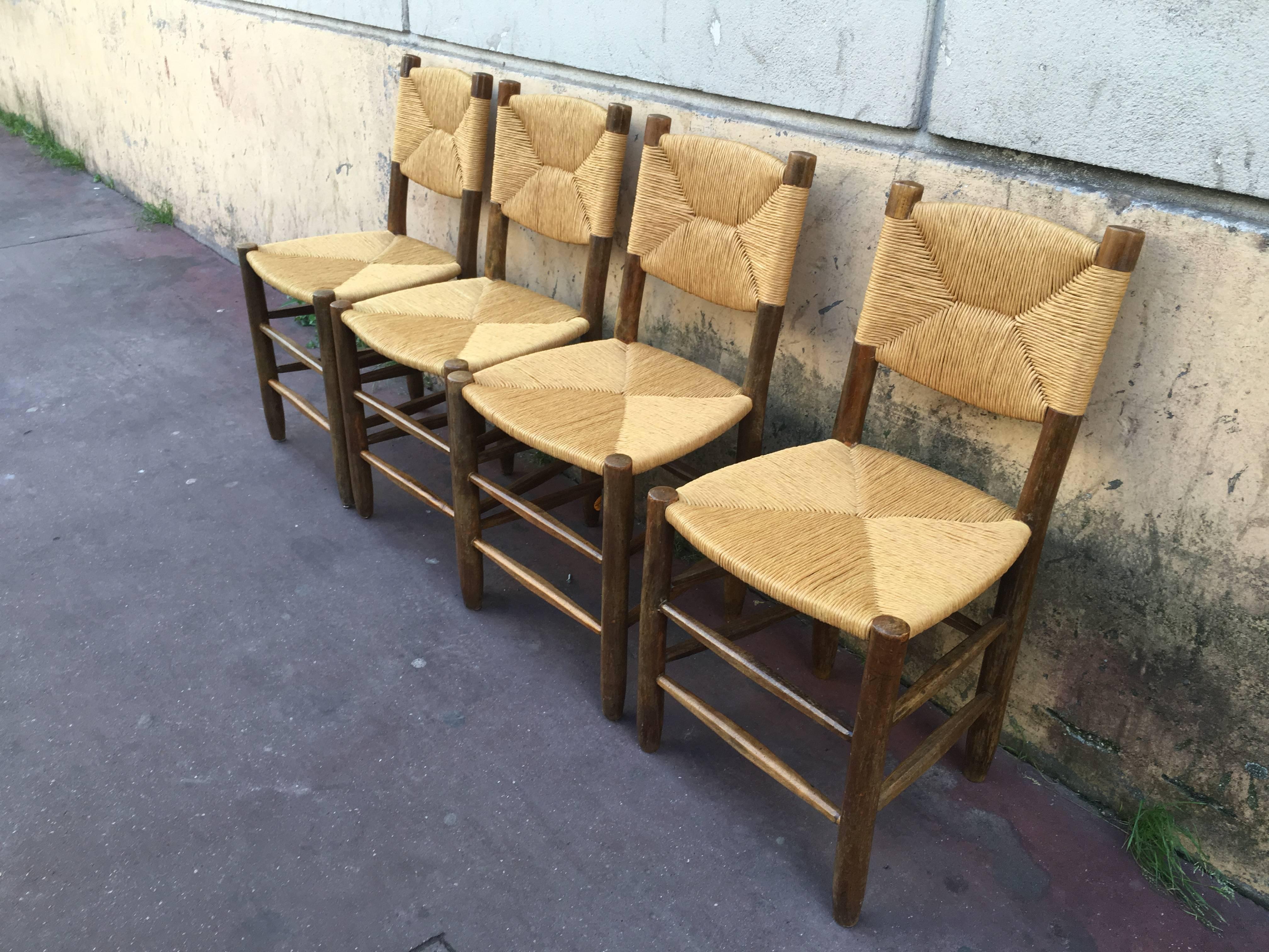 Mid-20th Century Charlotte Perriand Set of Four Rush Chairs, Model Bauche, Good Vintage Condition For Sale