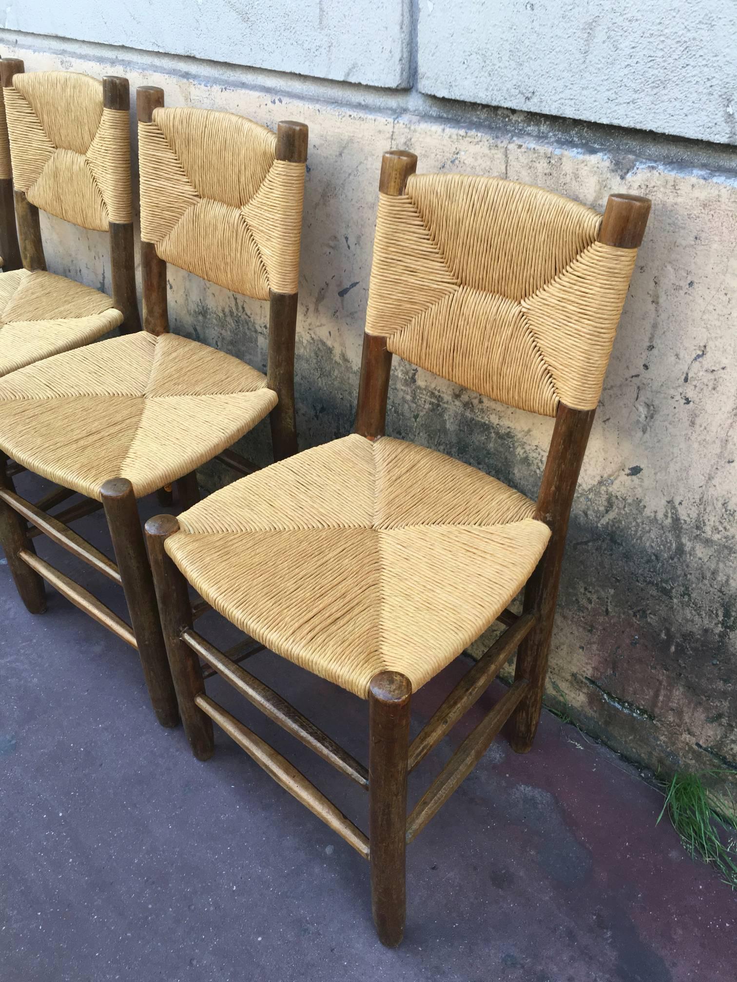 Charlotte Perriand Set of Four Rush Chairs, Model Bauche, Good Vintage Condition In Excellent Condition For Sale In Paris, ile de france