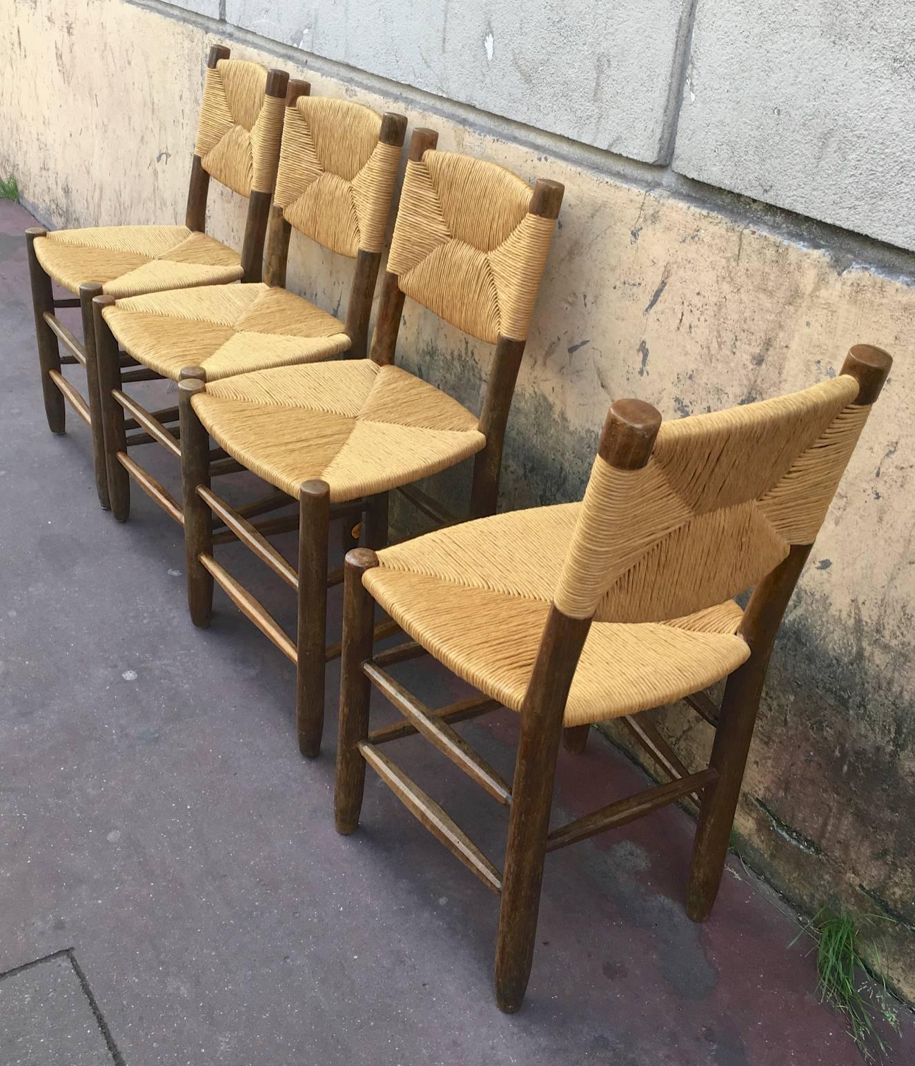 Charlotte Perriand set of four rush chairs, model Bauche in good vintage condition.