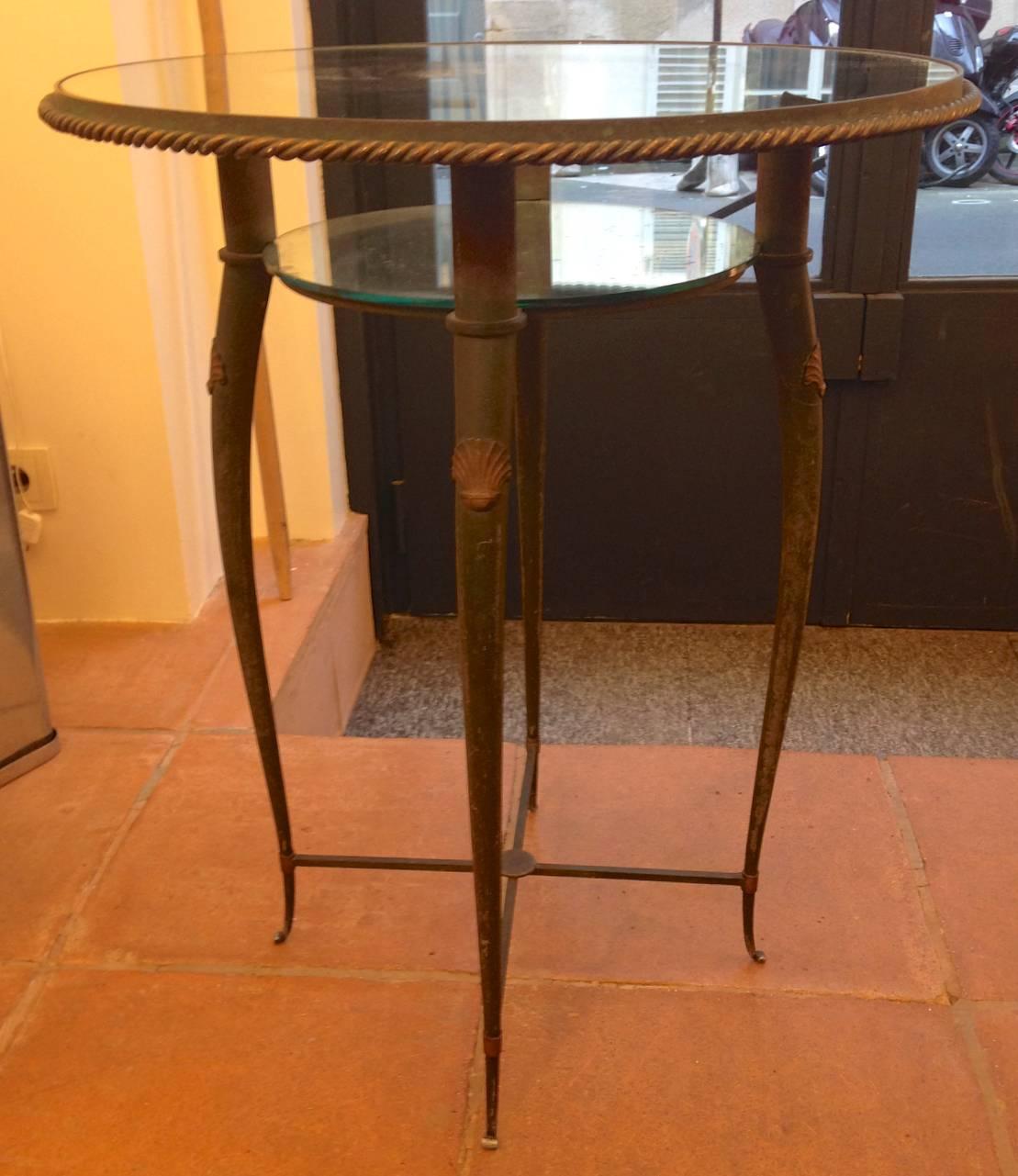In the style of A. A. Rateau refined patinated bronze two-tier side table.