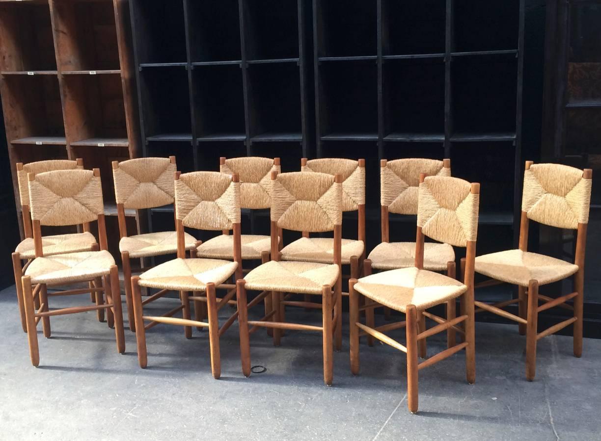 Charlotte Perriand rare set of ten rush model "Bauche" chairs in good vintage condition.