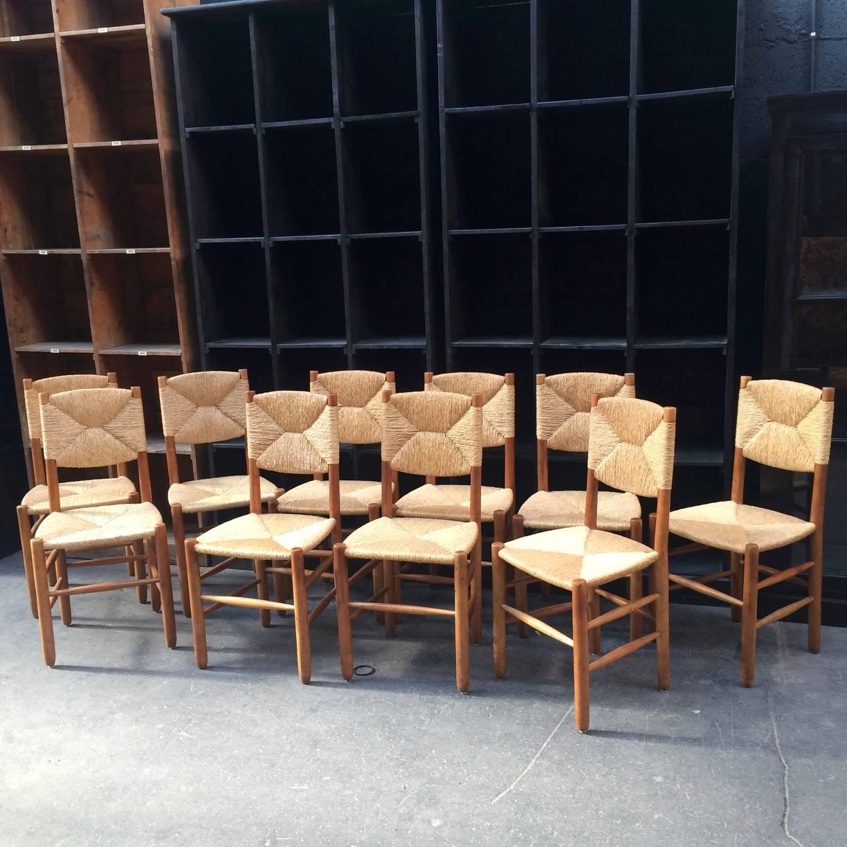 Mid-20th Century Charlotte Perriand Rare Set of Ten Rush Bauche Chairs For Sale