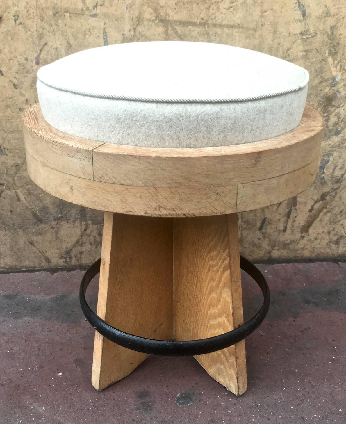 Awesome modernist round stool in oak, newly covered with an iron circle.