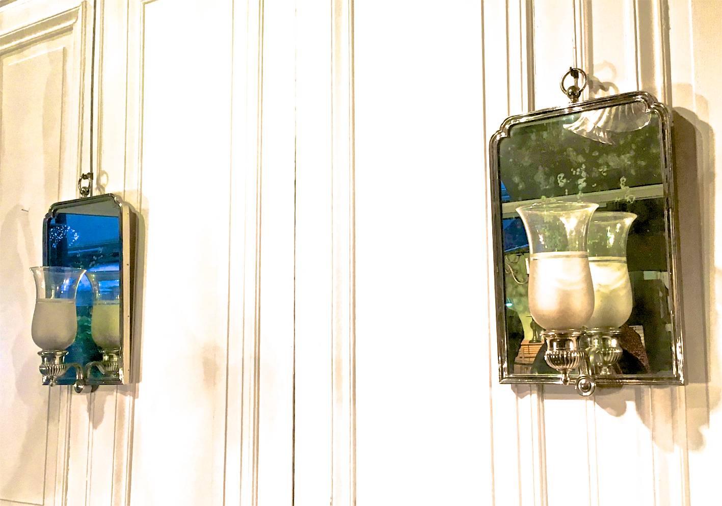 Maison Jansen chic pair of Neoclassic silver bronze frame mirrored sconces.