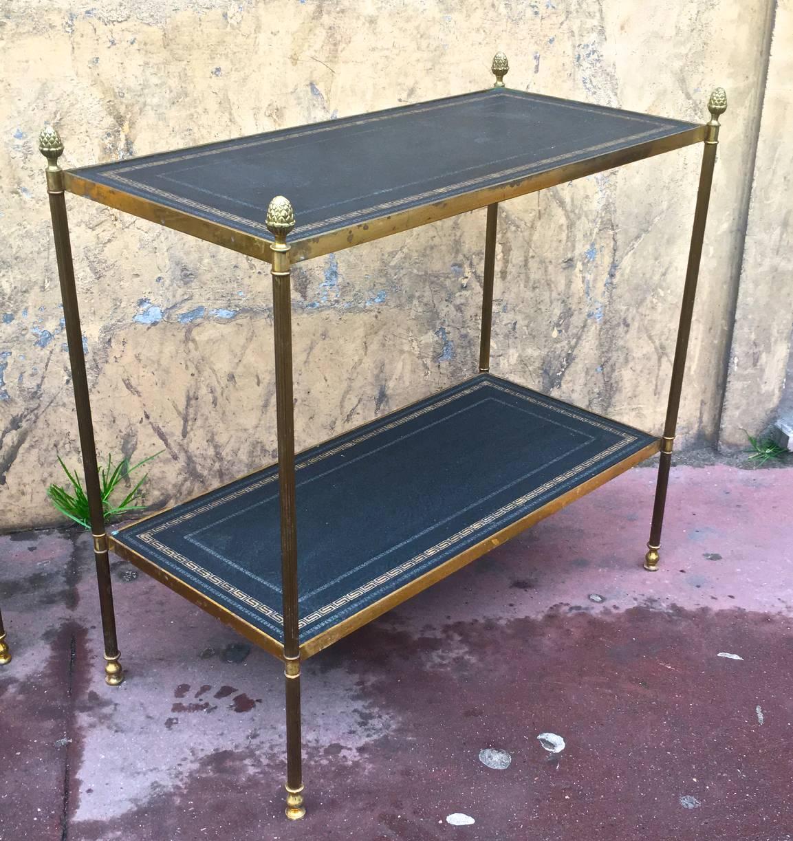 Maison Jansen pair of two-tier neoclassic side table with gold adorn leather top.
