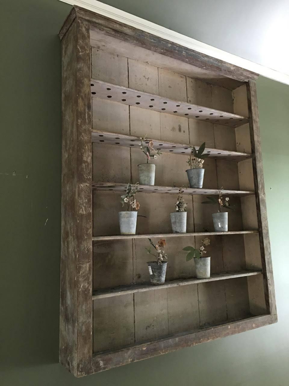 Charming French shelves with distressed grey paint.