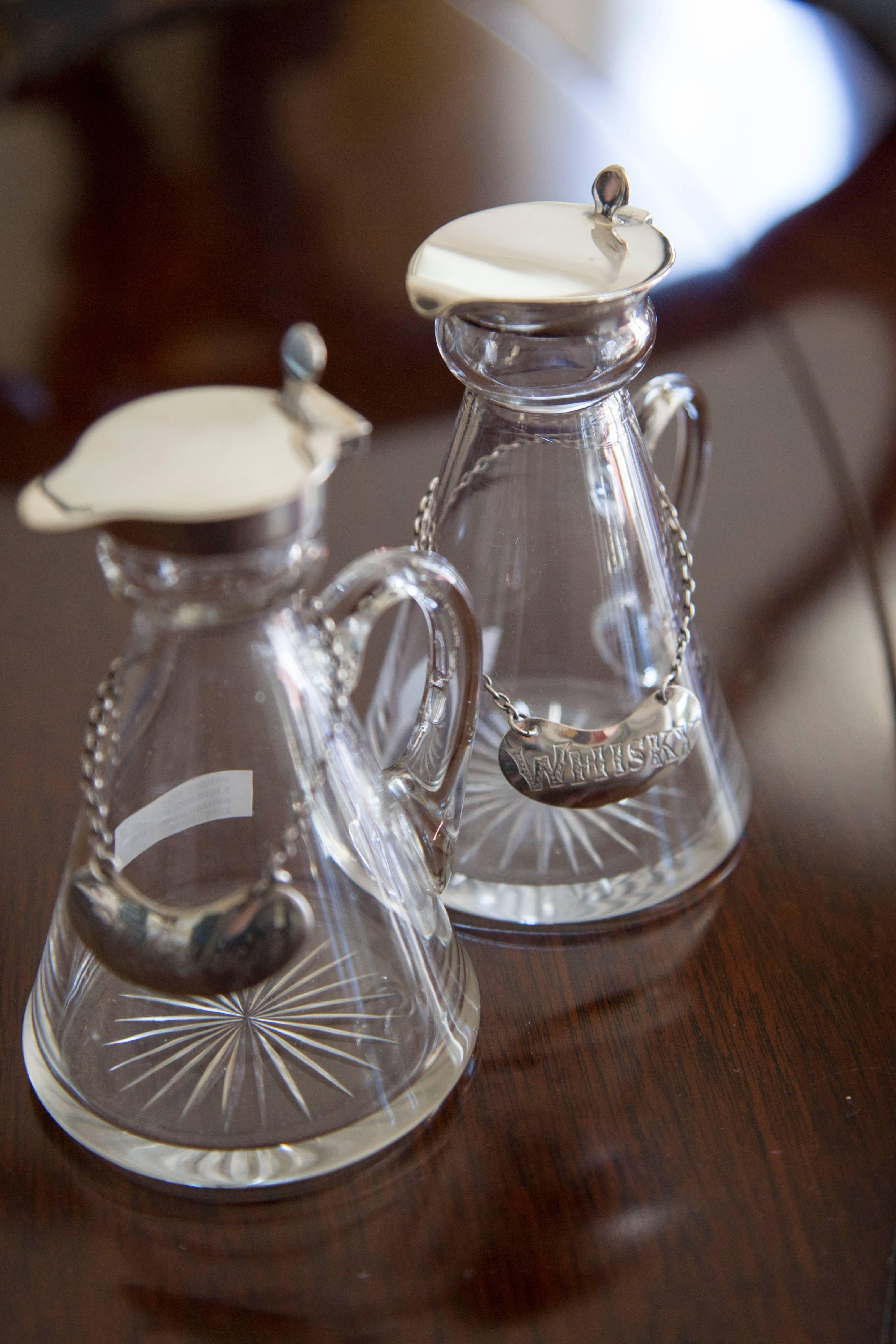 These whiskey tots were provided for guest bedrooms in large country houses for shooting weekends (think Gosford Park or Downton Abbey). Today they make charming vases for flowers on a dinner table or individual nosegays by a bed or on a
