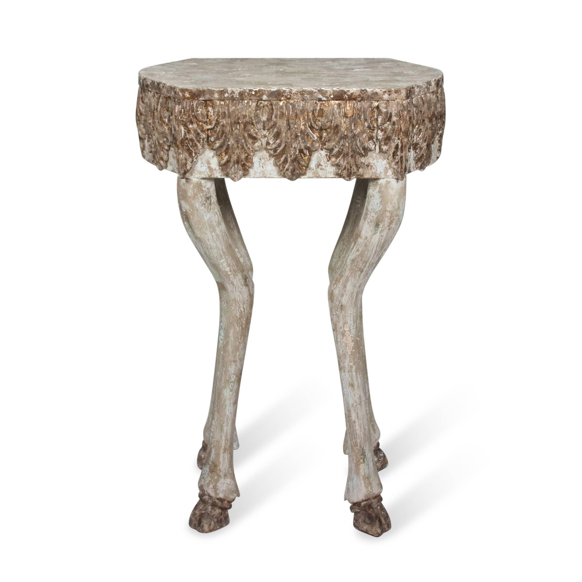 Animal form wood occasional table, shaped rectangular top surface with carved acanthus leaf side decoration, and deer form legs with hoofed feet, gilt and limed, American, 1980s. Measures: Height 30 1/4 in, width 20 1/4 in, depth 12 in.