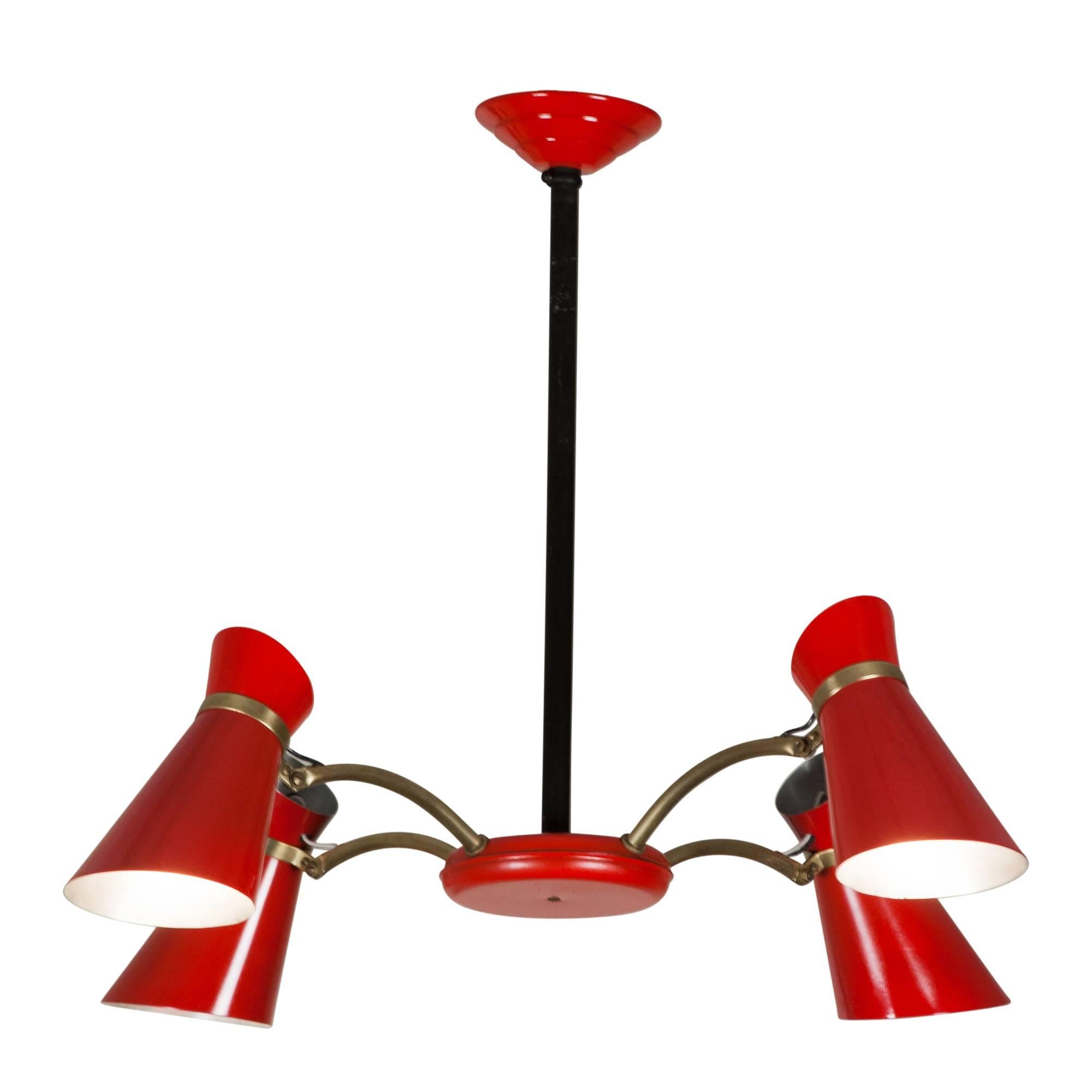 Lacquered metal and brass four-light chandelier, the shades and central disc in bright red, each shade with three bands of perforations and each shade adjustable with a hinge joint, French, 1950s. Measures: Diameter 26 in, overall height 20 in,