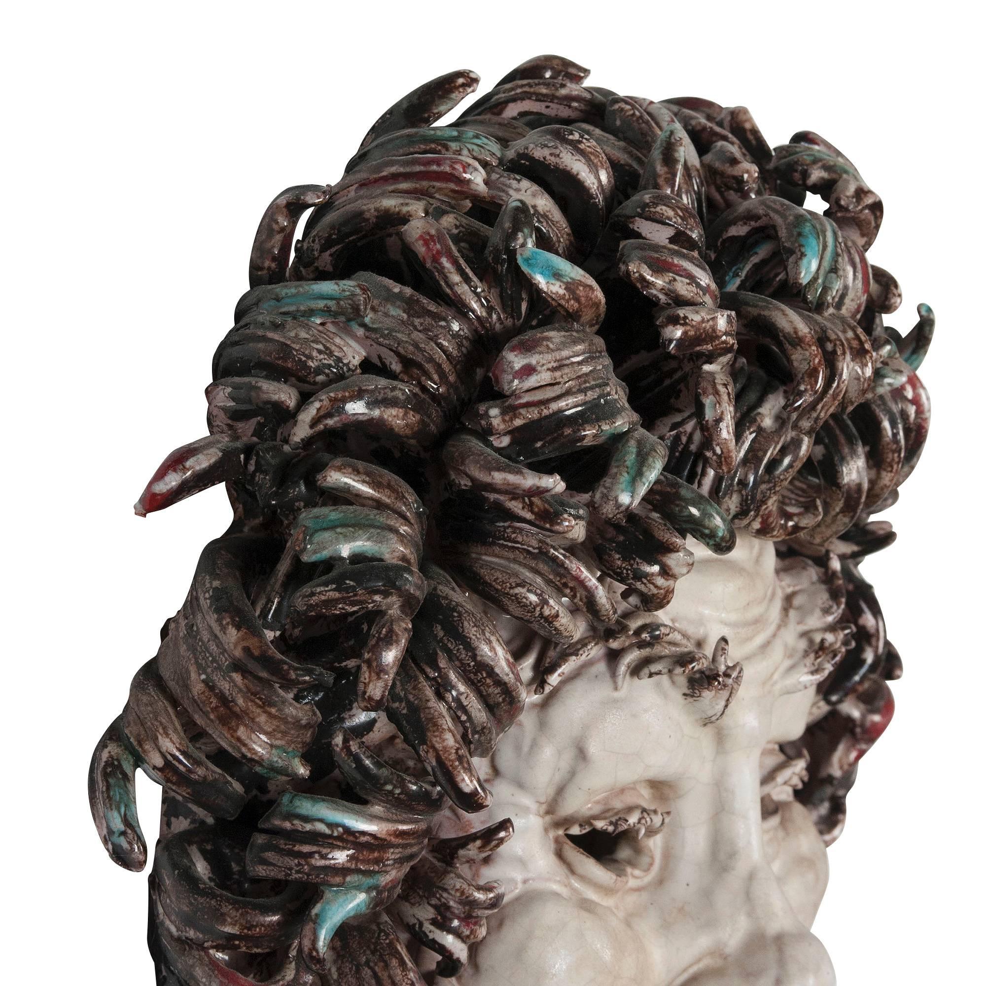 Joyfully expressive glazed ceramic head, pale white face, brown curly hair, open mouth, by Eugenio Pattarino (b.1885-1971), Italian, 1940s. Signed to backside. Measures: Height 12 in, width 11 in, depth 4 in. (Item #1990)