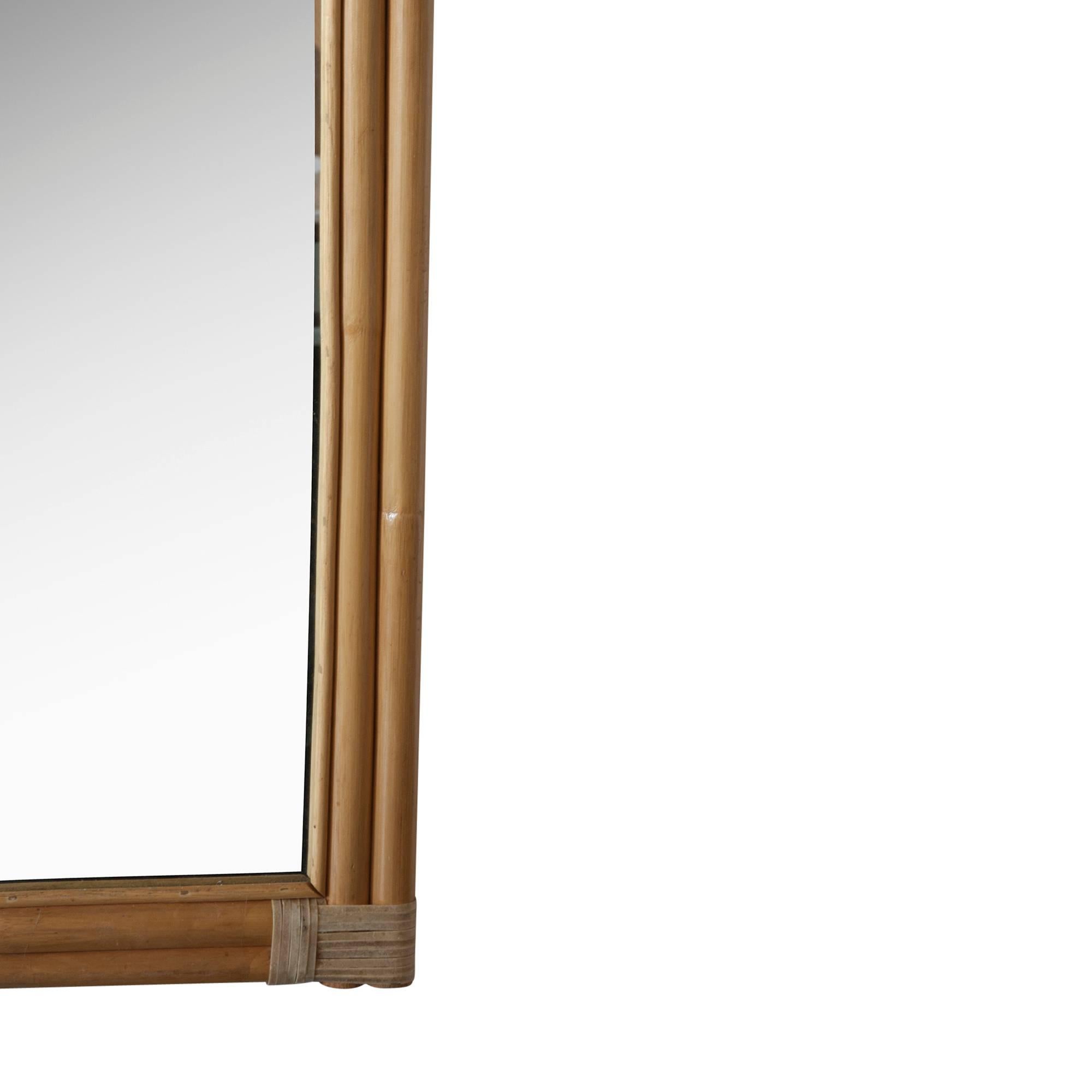 Bamboo frame and caned mirror, rectangular form with arch-top, rays emanating from center of top to the outer edges, American, circa 1970. 
Measures: Height 60 in, width 29 1/2 in. (Item #2138 sats)
 